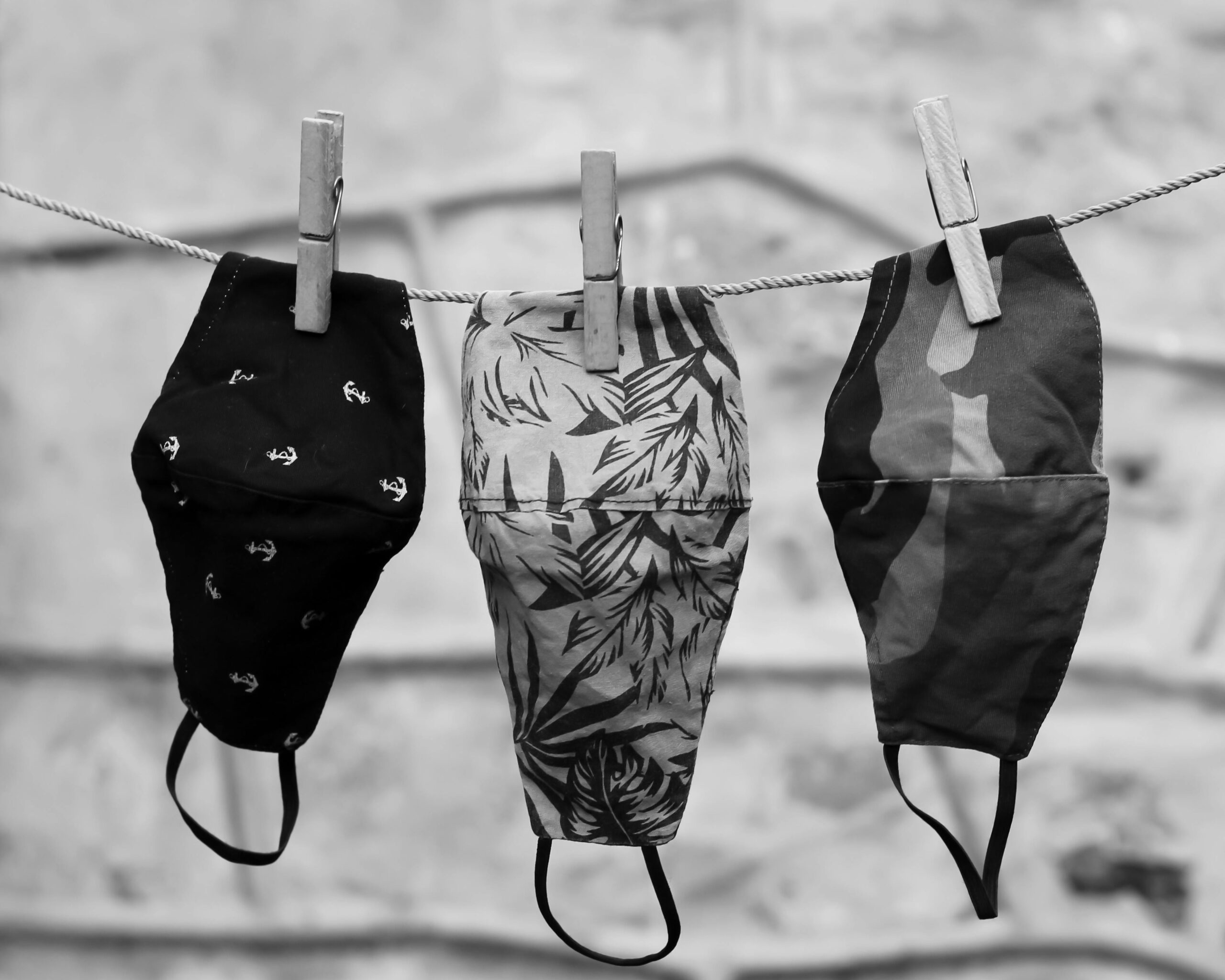 Covid-19 face masks hanging from a clothing line